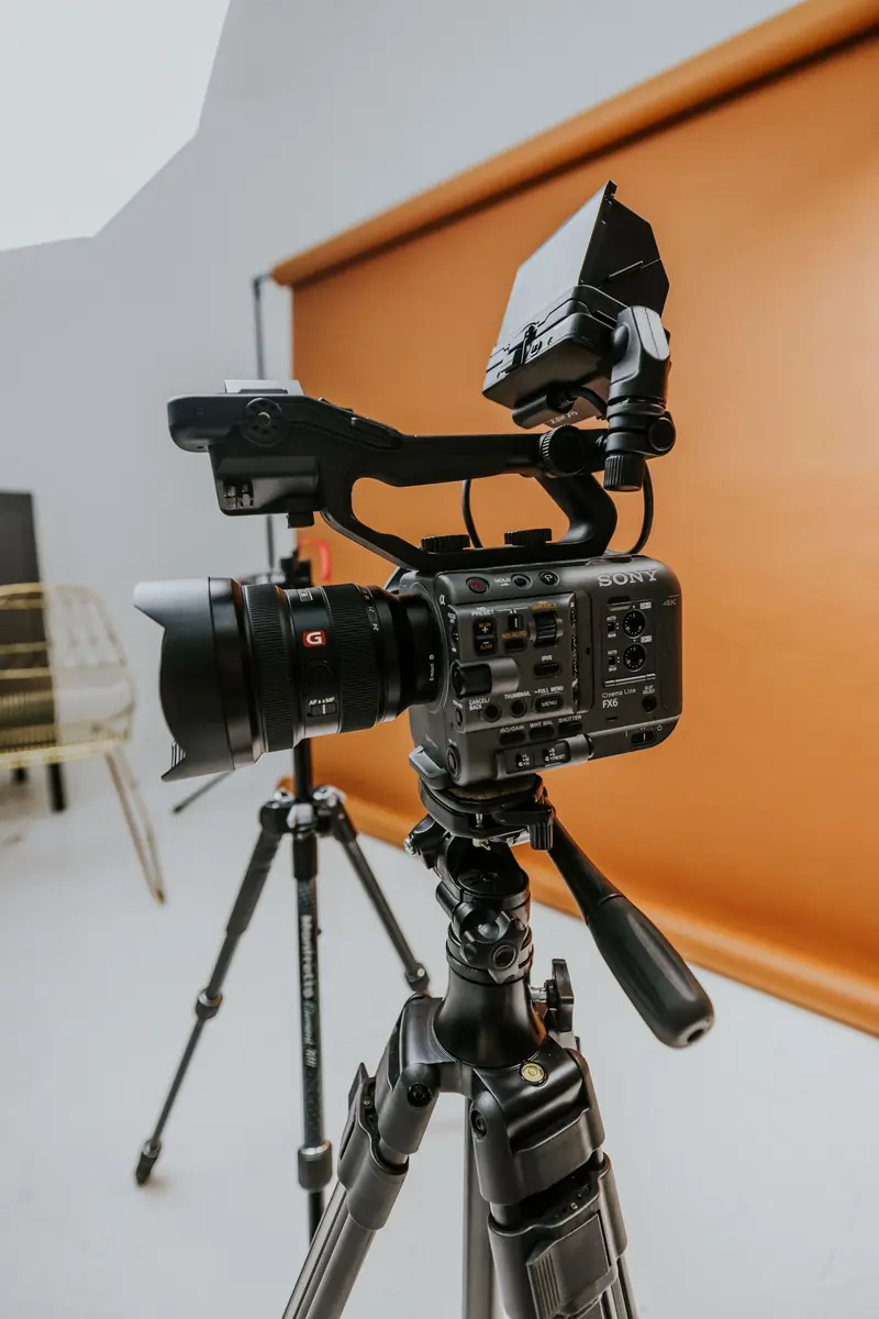 Professional video camera on a tripod in a studio, used to shoot short-form video ads