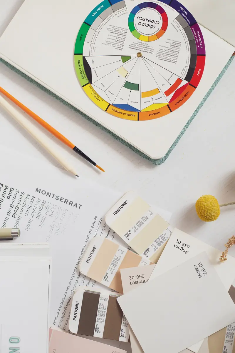 Creative workspace with colour swatches and a mood board for visual ad campaigns