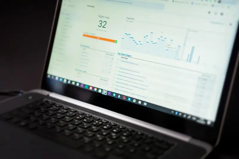 Laptop showing a paid search performance dashboard